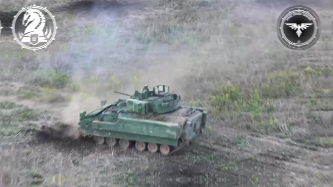 Ukrainian bradley engaging Russian positions in a treeline