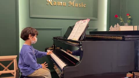 Cute child playing the piano