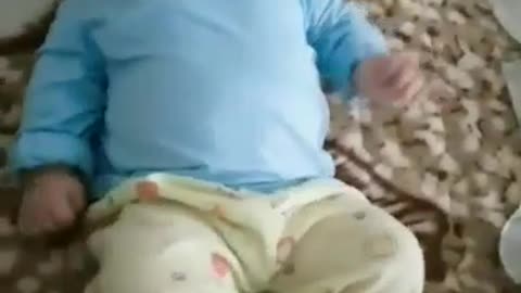 Cute baby. Lying playing alone