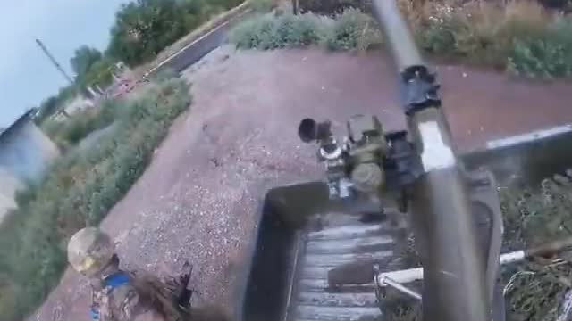 Ukrainian soldier firing an SPG-9 mounted on a pickup truck.