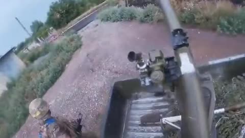 Ukrainian soldier firing an SPG-9 mounted on a pickup truck.