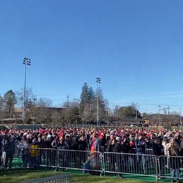 An enthusiastic crowd chants ahead of President Donald Trump’s rally