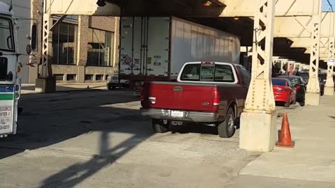 Truck stuck under bridge