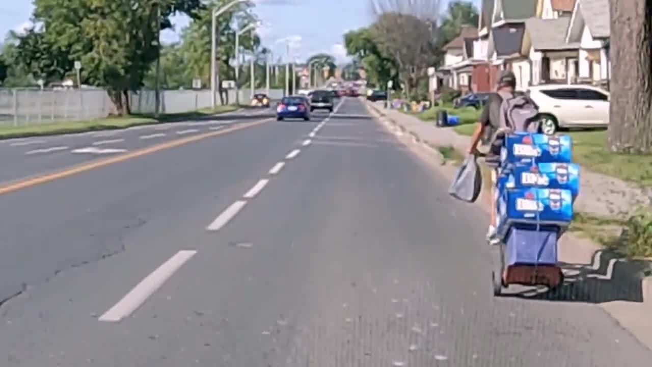 This cyclist takes his summer refreshments very seriously