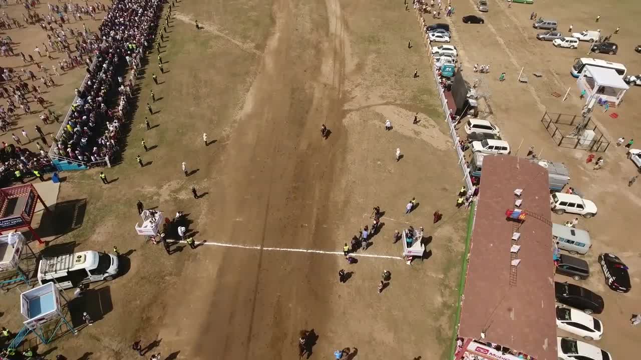 Aerial drone shot finishing line Naadam horse racing in mongolia