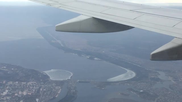 flight in an airplane over the river