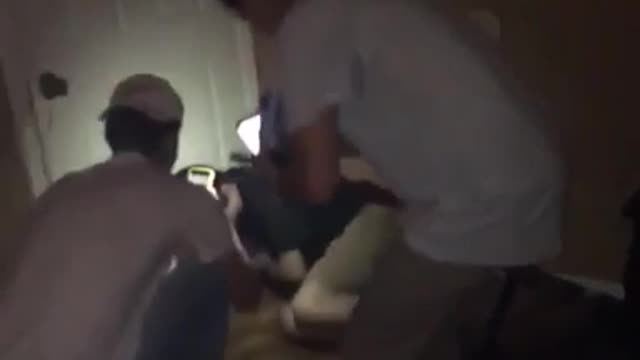 Guy black shirt drinking rum falls backward