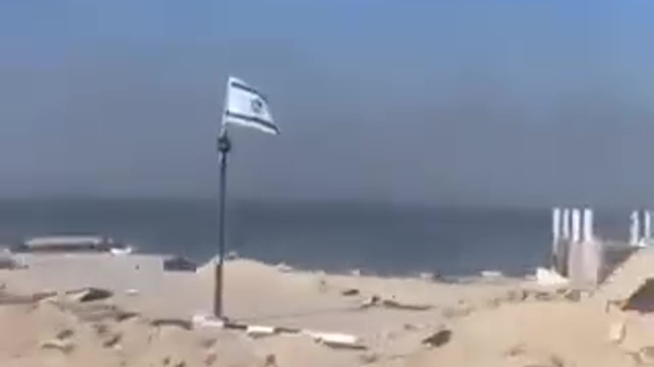 Israeli flags along one of the military routes in Gaza