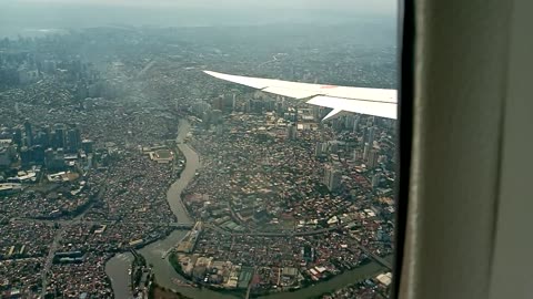 Flying 🪽 over Metro Manila