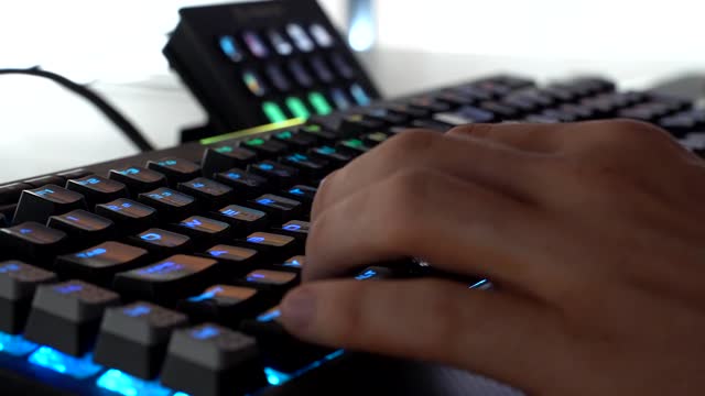 A Hand Working On Keyboard