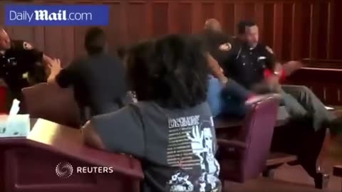 Brothers attack mothers killer in court