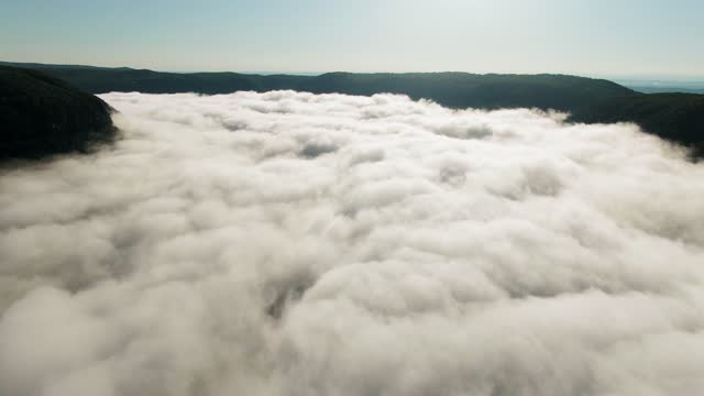 Thick Low Lying Clouds Covering A Mountain Valley