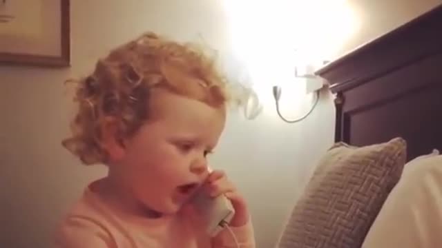 Cute baby calls her friend