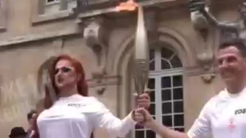 Two men light the Olympic flame instead of a man and a woman, with the woman