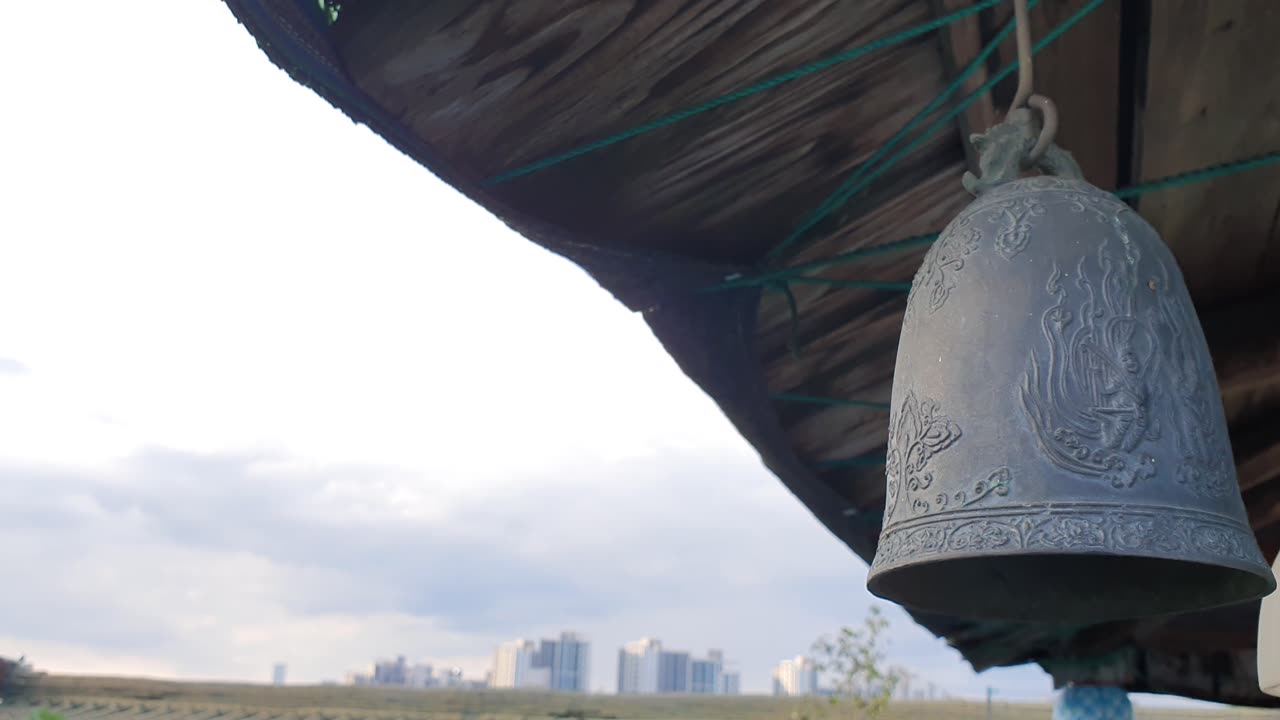 bell and sky under the eaves