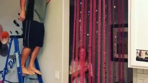 Guy blue ladder pops balloon scares girl