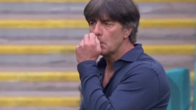 Ha ha ha! The coach of the German national soccer team picks in his underpants and sniffs his...