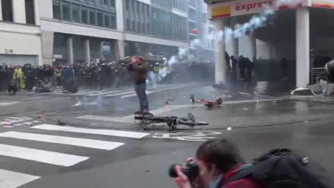 Tear gas, water cannons fired as thousands protest against COVID restrictions in Brussels.