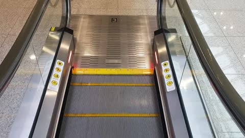 Go to the escalator to board the plane.