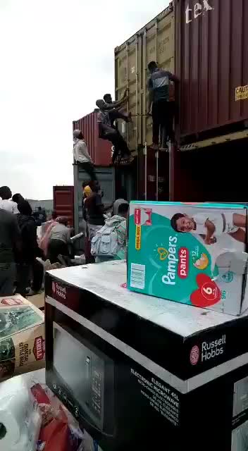 Civilians Looting Shipping Containers in South Africa