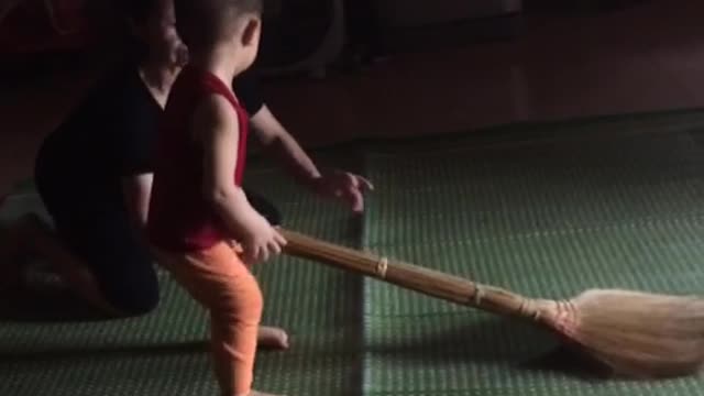 baby and magic broom