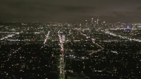 Aerial view of a large avenue in a city at night