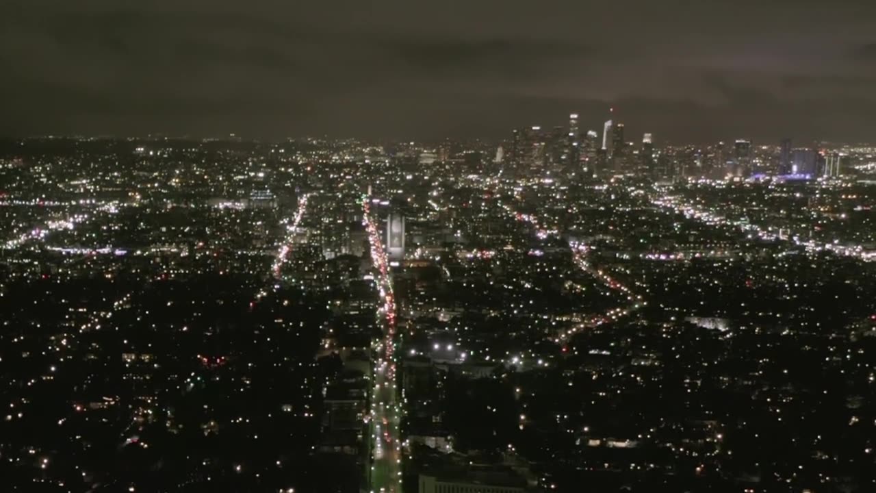 Aerial view of a large avenue in a city at night