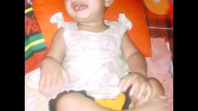 The baby is crying loudly. Look at her cuteness...
