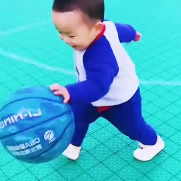 Baby playing ball in romantic way