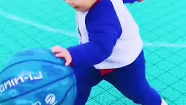 Baby playing ball in romantic way