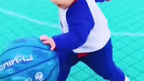 Baby playing ball in romantic way