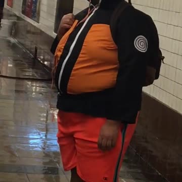Guy dressed as naruto orange costume