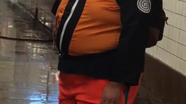 Guy dressed as naruto orange costume