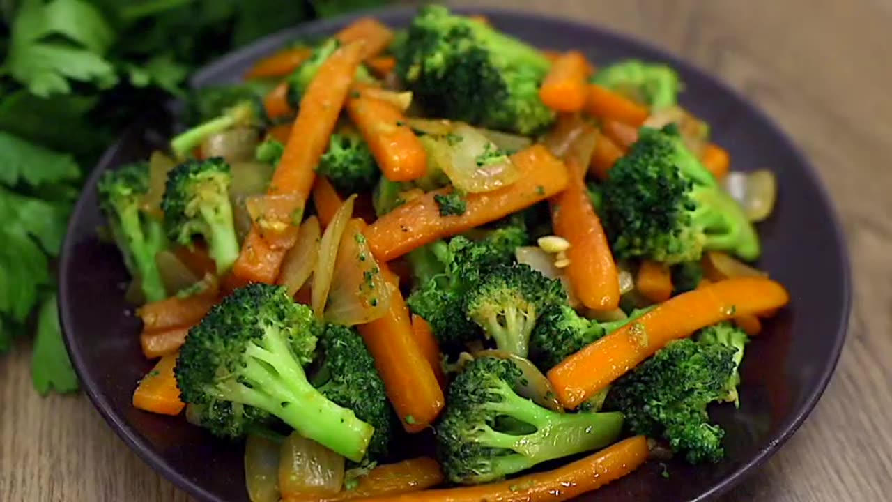 Quick and delicious! Broccoli with carrots in a frying pan.