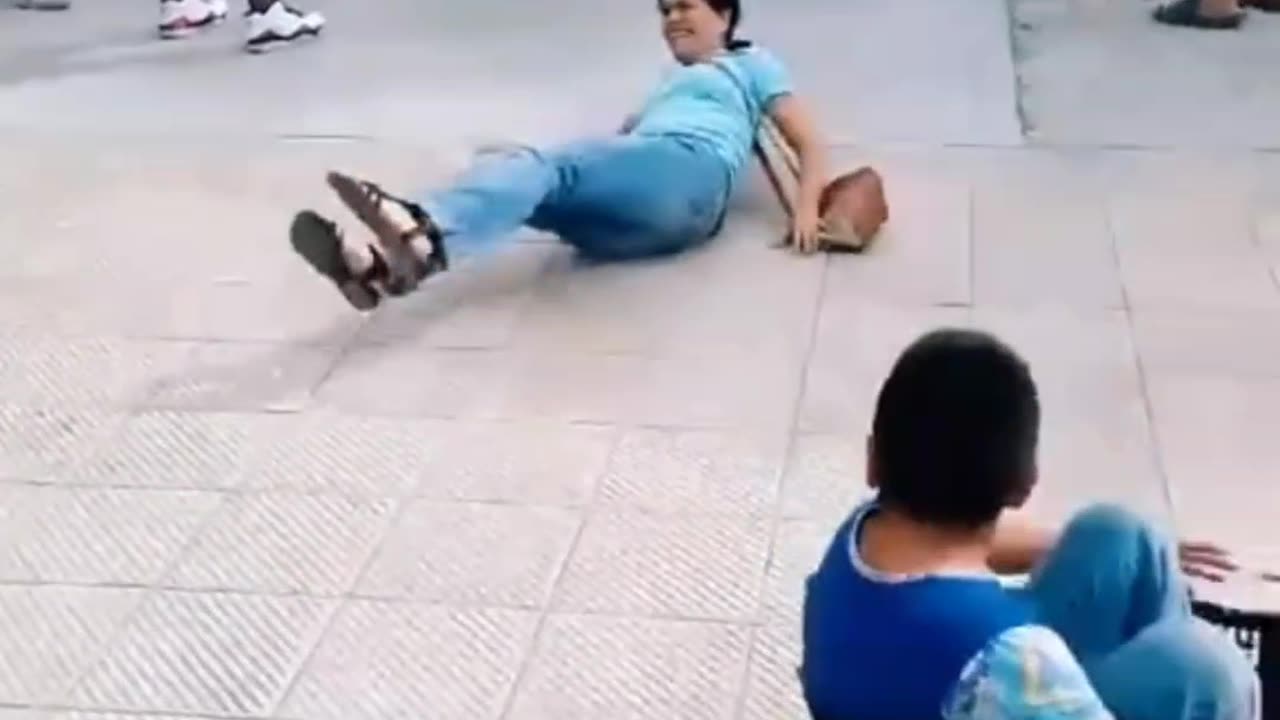 BOY SLIDES DOWN A SLIDE AND KNOCKS DOWN A WOMAN 😥😥😥😥