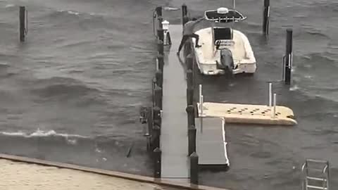 Man Makes Mad Dash to Save Boat From Storm