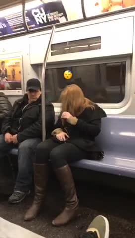 Red hair woman falls asleep into pole on subway