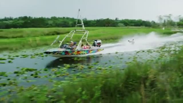 Incredible barefoot water-skiing behind an airplane