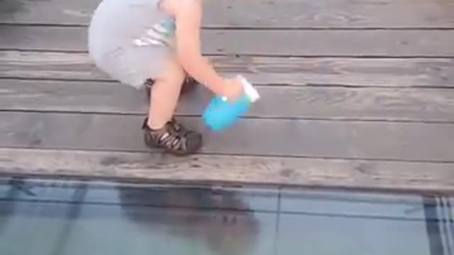 Toddler attempts to cross onto glass bridge