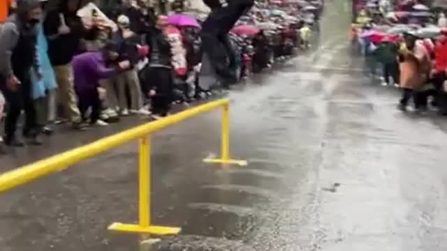 Guy skates a grind rail with his shoes