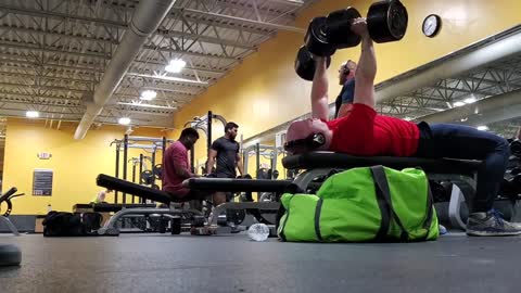 bench with 100 pound dumbbells