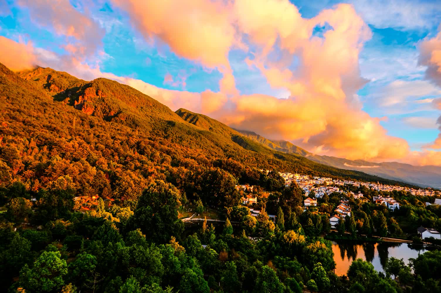 Time-lapse. The evolution of clouds on the mountainside at sunrise.