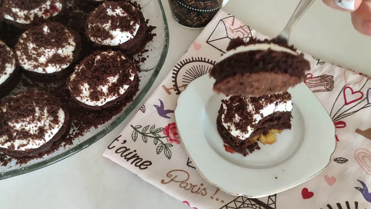 Delicate chocolate cakes with cream and jam