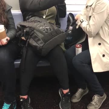 Woman kisses dinosaur hand puppet