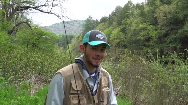 FLY FISHING FOR TROUT IN THE MOUNTAINS