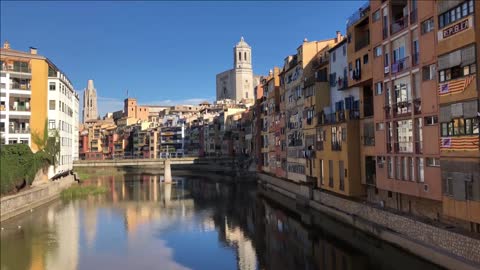 view over the onyar river with the cathedral of girona spain