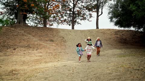 Girls Running Together while Holding Hands