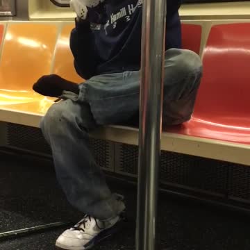 Guy smelling and spraying water product onto shoe