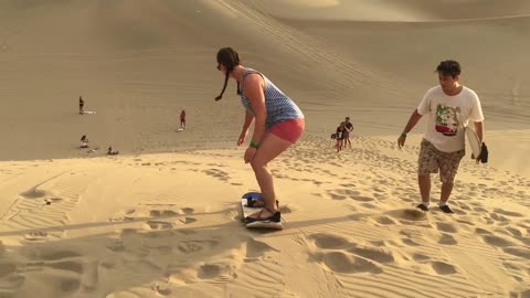 Beautiful sandboarding and sand sledding