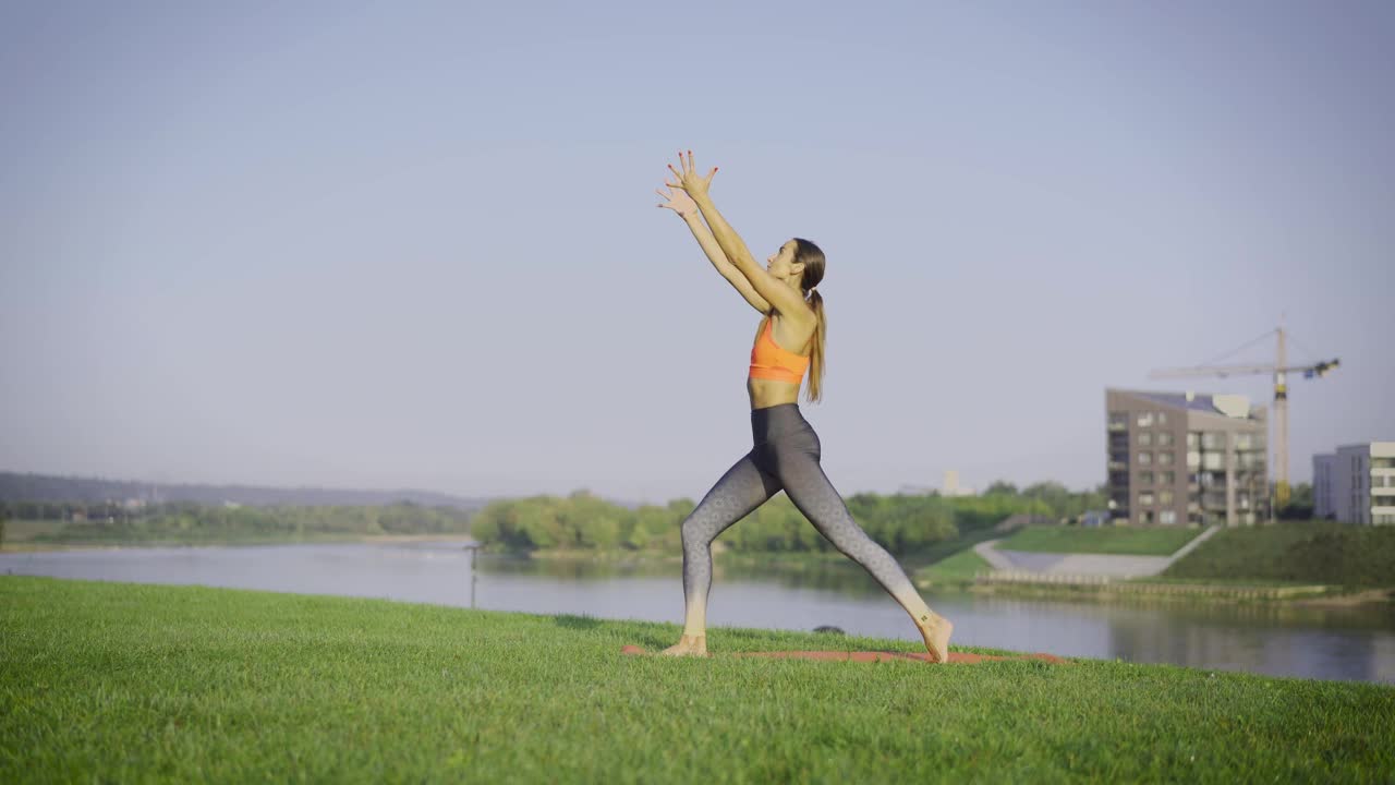 A woman practicing yoga outdoors